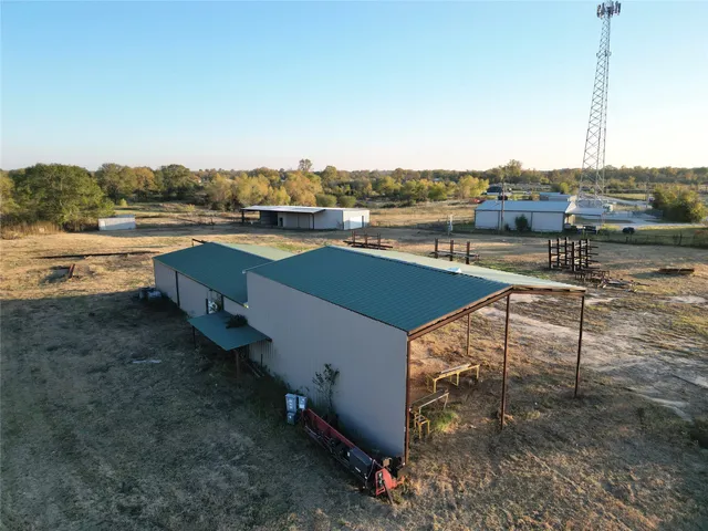 a view of a terrace with lawn chairs