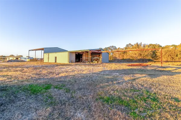 a view of a house with a yard and ocean view
