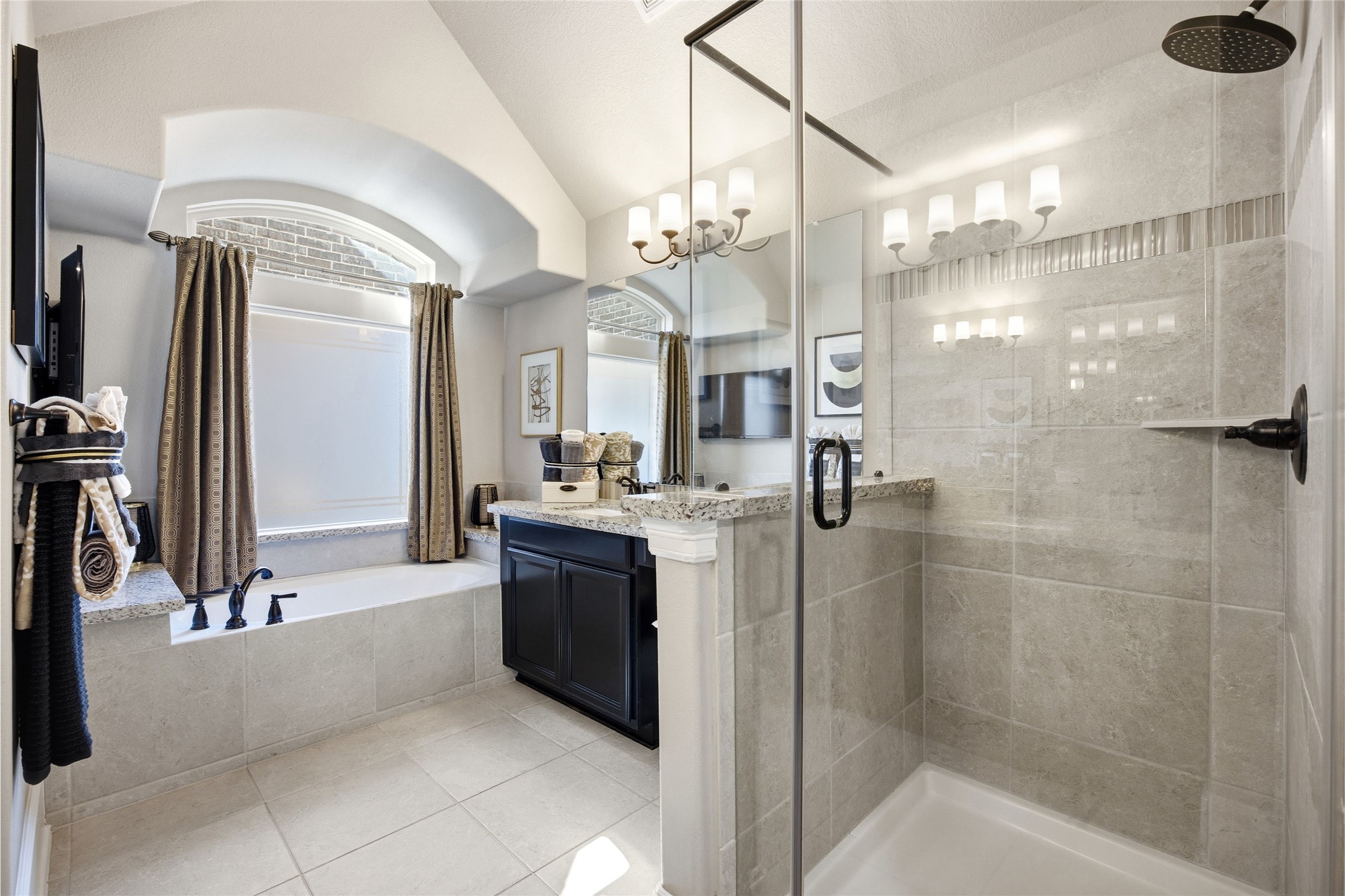 3313 Flagstone Drive Manvel, TX 77578 - Photo 21 of 39 a bathroom with a granite countertop sink a mirror and shower
