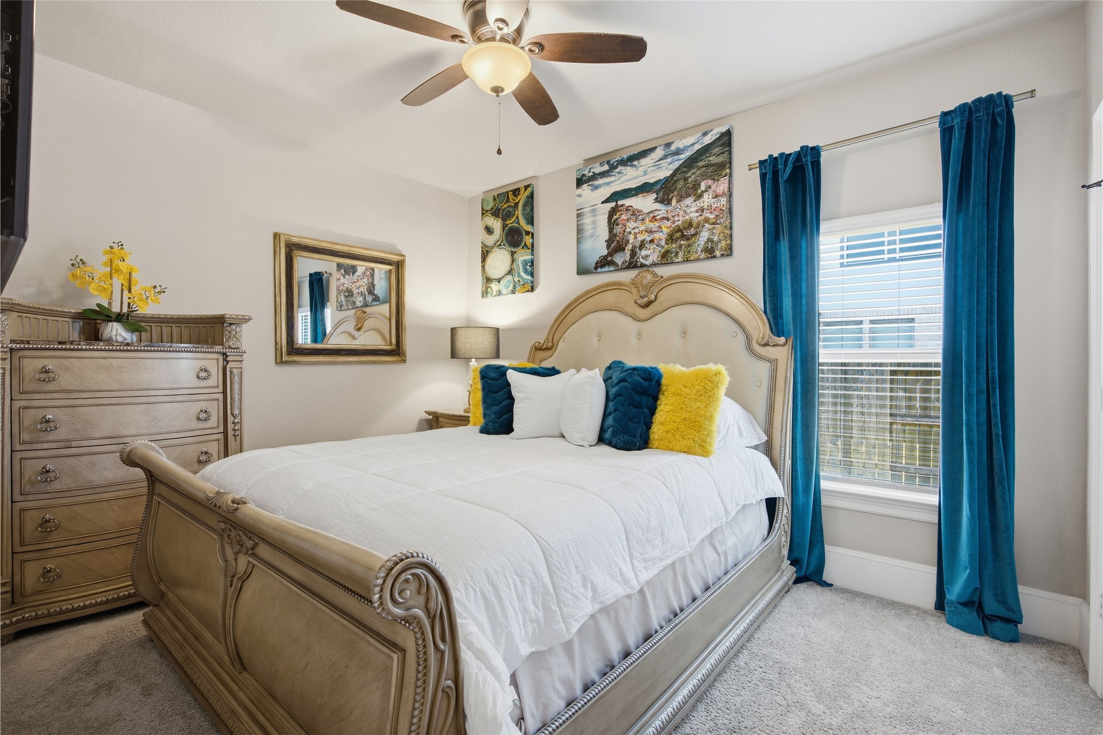 3313 Flagstone Drive Manvel, TX 77578 - Photo 25 of 39 a bedroom with a bed and a chandelier