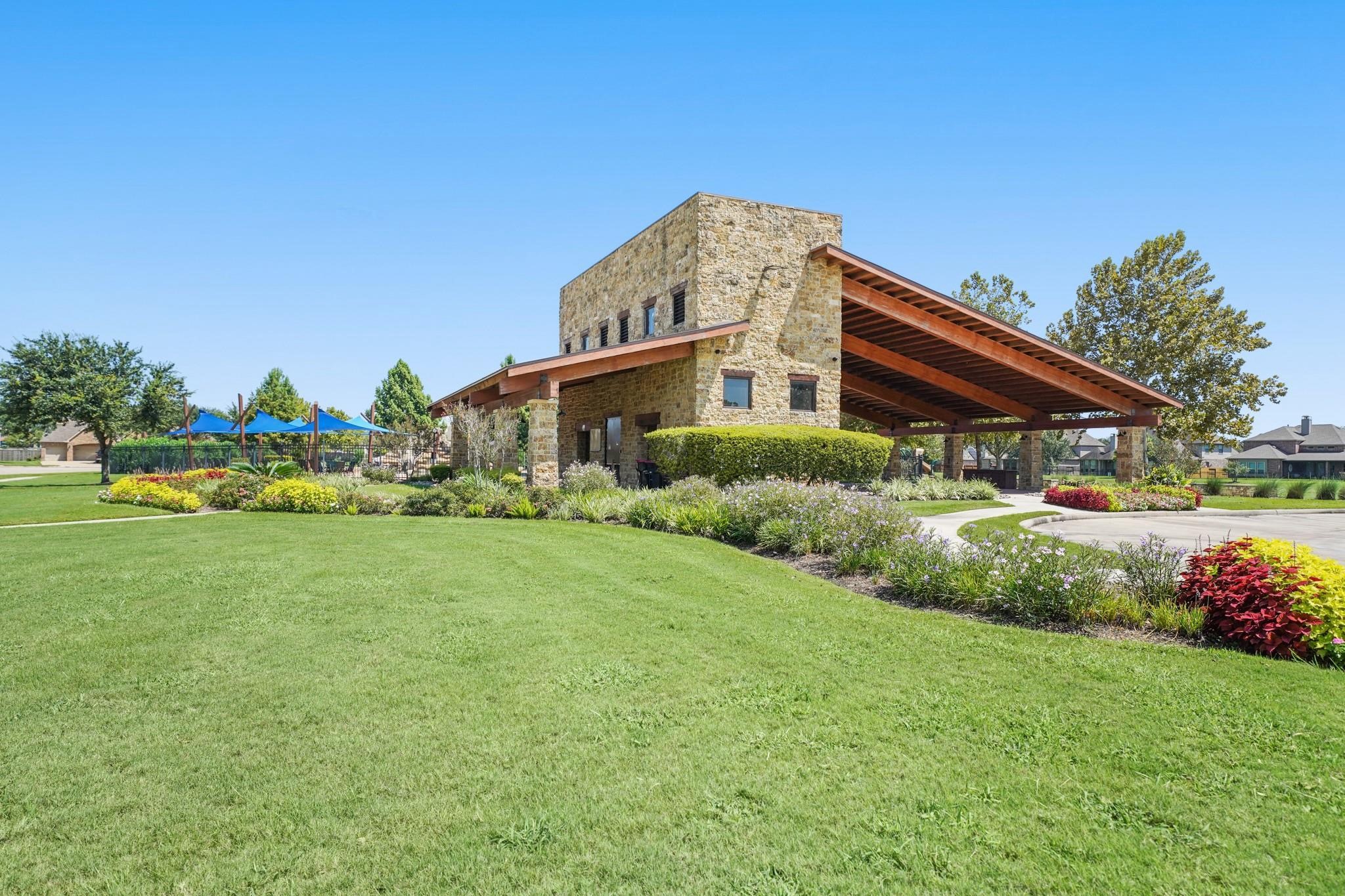 3313 Flagstone Drive Manvel, TX 77578 - Photo 37 of 39 a front view of a house with a garden and pathway