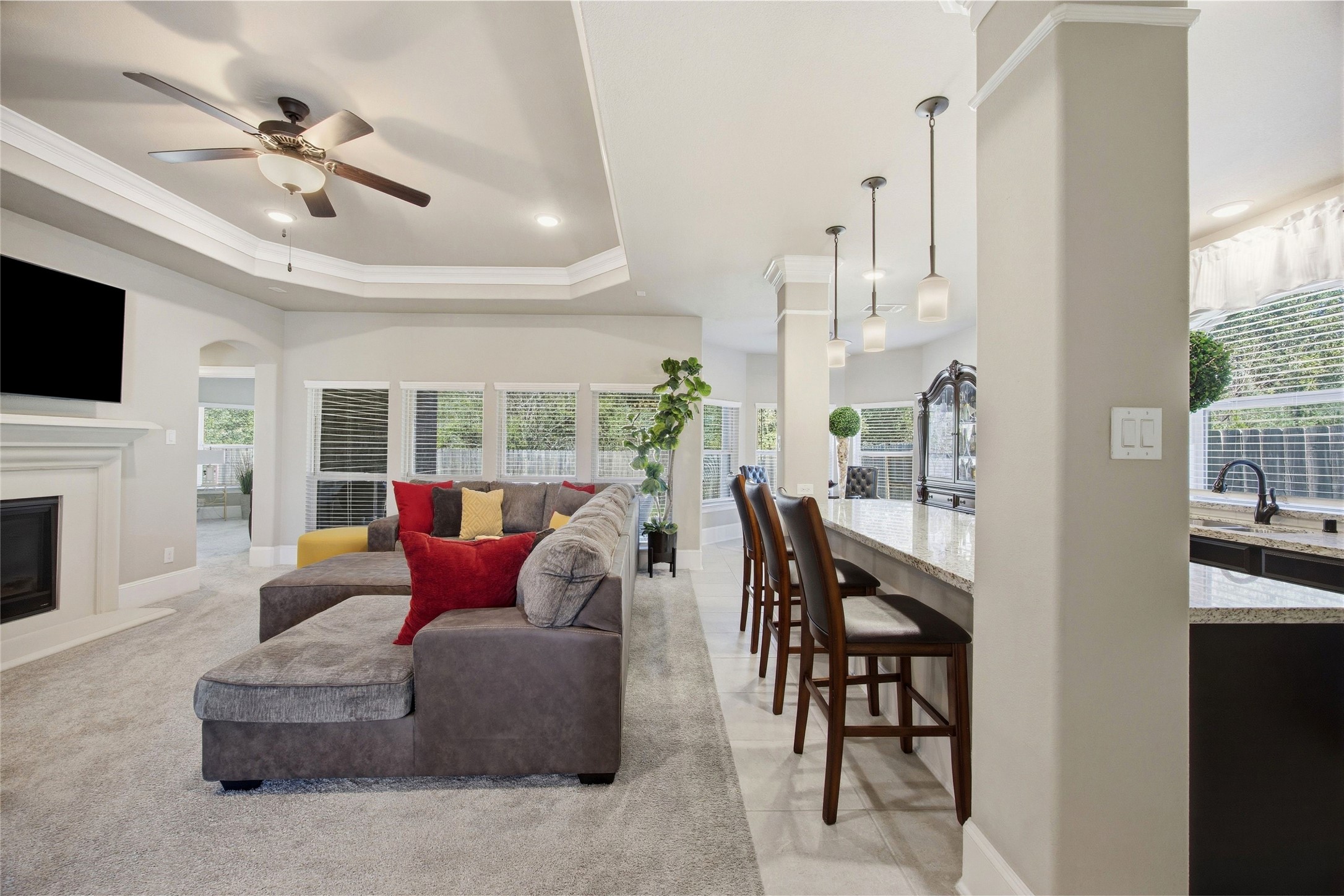 3313 Flagstone Drive Manvel, TX 77578 - Photo 6 of 39 a living room with furniture a fireplace and a floor to ceiling window