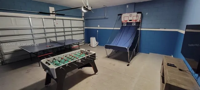 a view of a workspace with furniture