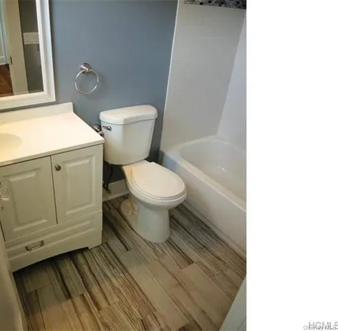 a bathroom with a toilet and a sink