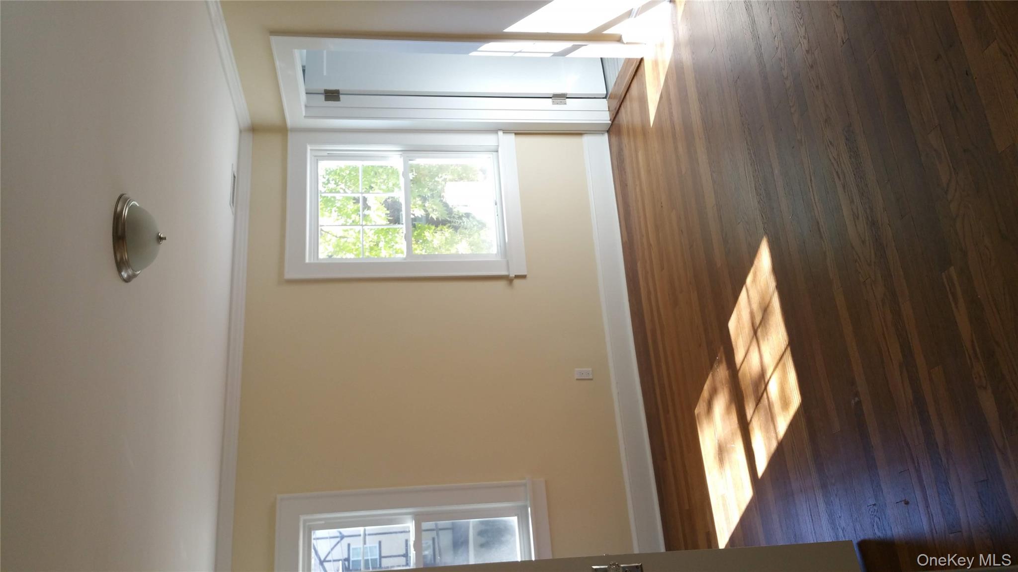 471 Webster Avenue New Rochelle, NY 10801 - Photo 5 of 22 Unfurnished room featuring crown molding and wood finished floors