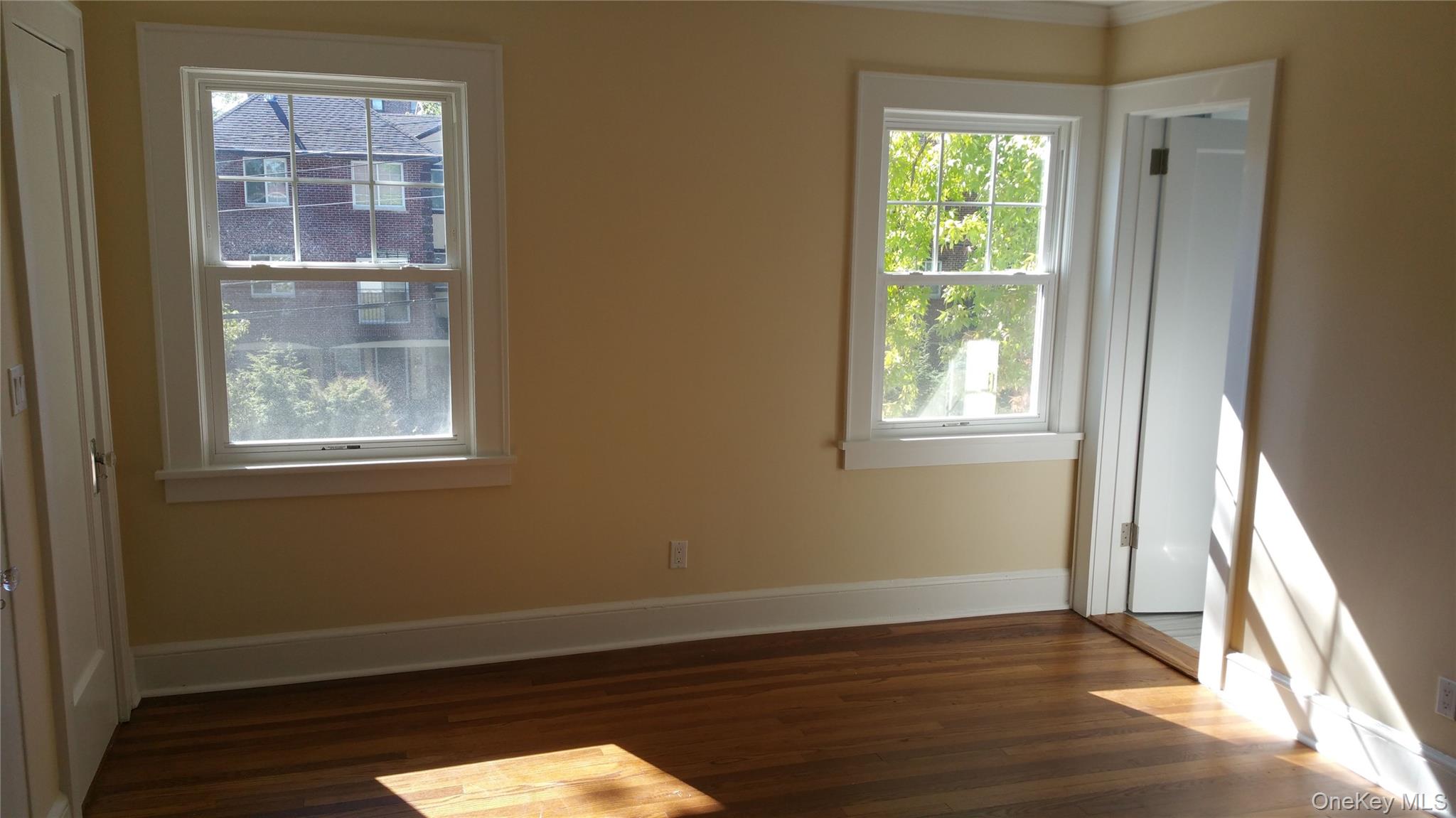 471 Webster Avenue New Rochelle, NY 10801 - Photo 6 of 22 Unfurnished room featuring dark wood-style floors