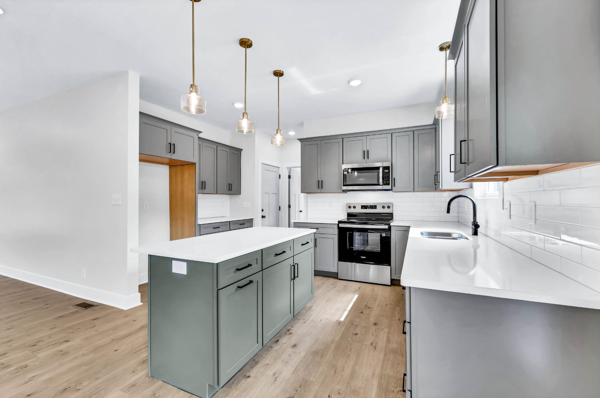 5590 Chambers Road Cumberland Furnace, TN 37051 - Photo 12 of 47 a kitchen with stainless steel appliances granite countertop a sink a stove and a refrigerator
