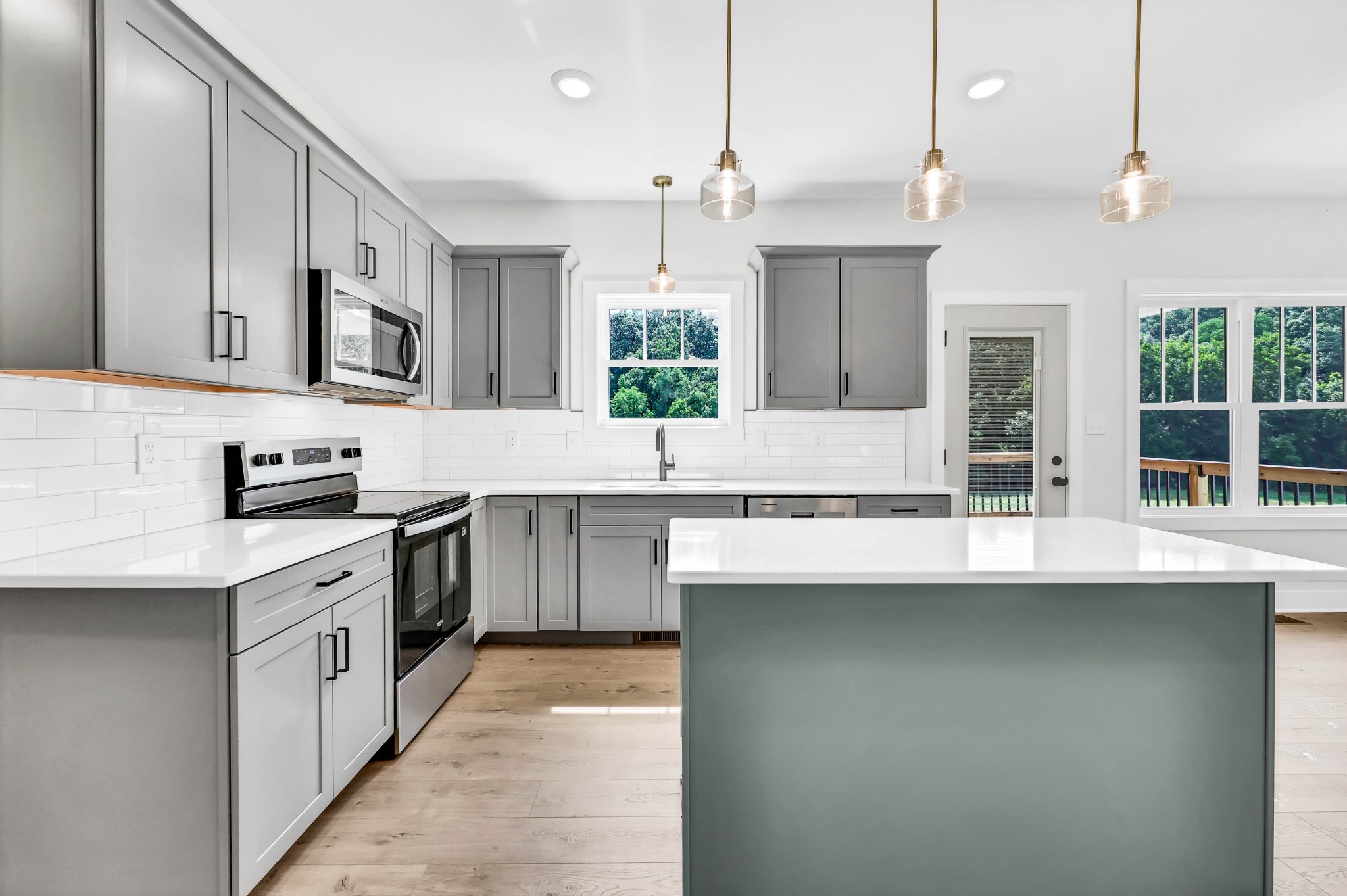 5590 Chambers Road Cumberland Furnace, TN 37051 - Photo 14 of 47 a kitchen with stainless steel appliances granite countertop a sink a stove and a refrigerator