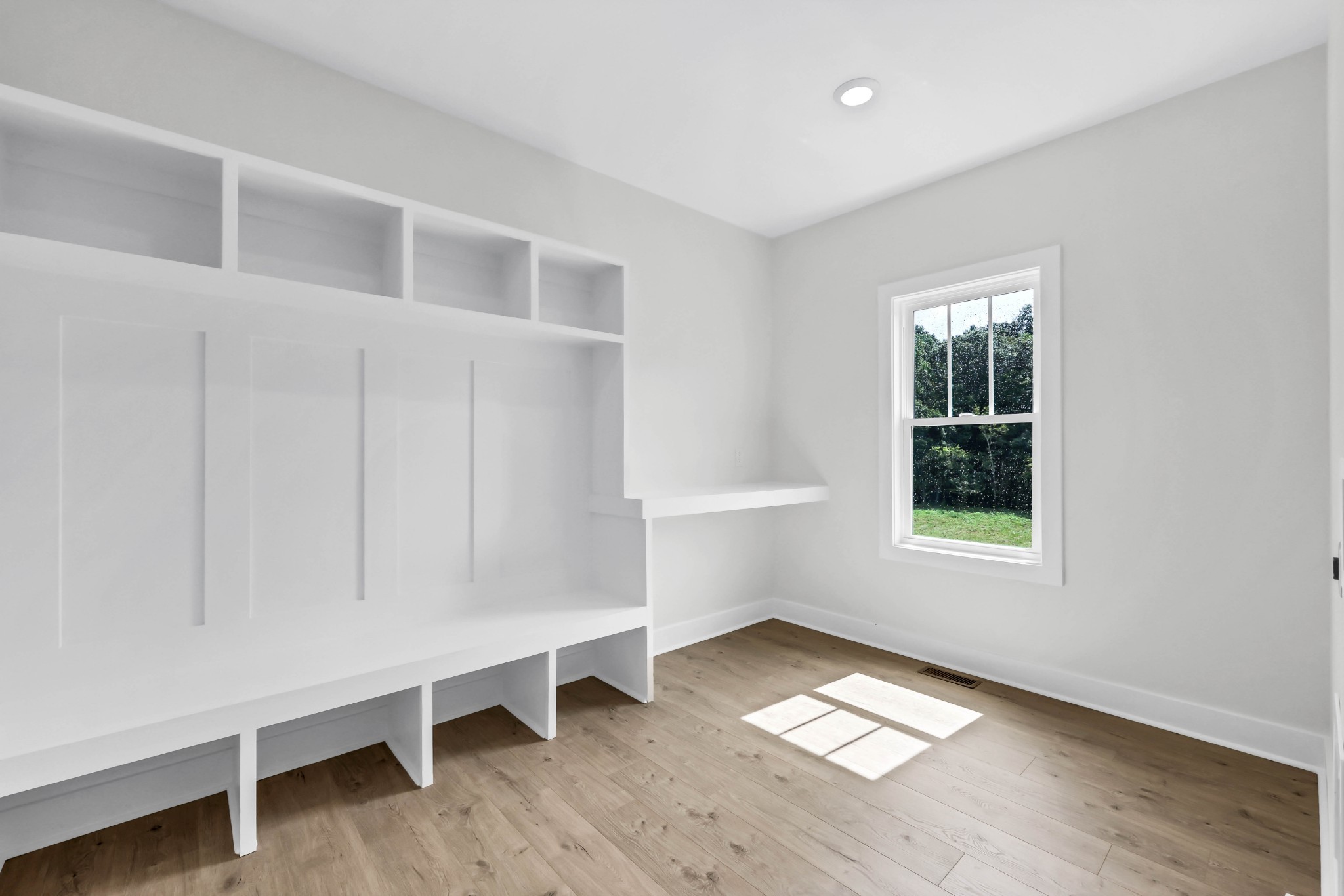 5590 Chambers Road Cumberland Furnace, TN 37051 - Photo 20 of 47 a view of an empty room with a window and wooden floor