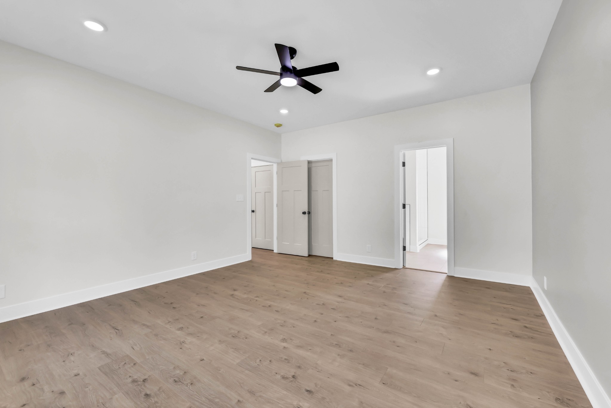 5590 Chambers Road Cumberland Furnace, TN 37051 - Photo 24 of 47 wooden floor in an empty room with a ceiling fan