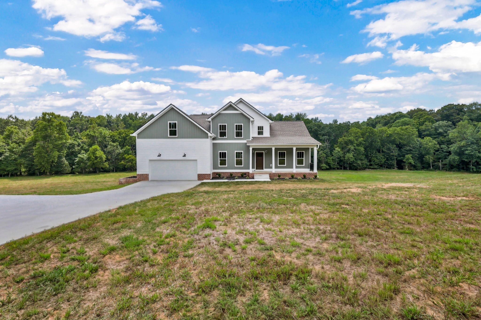 5590 Chambers Road Cumberland Furnace, TN 37051 - Photo 3 of 47 a front view of a house with a garden