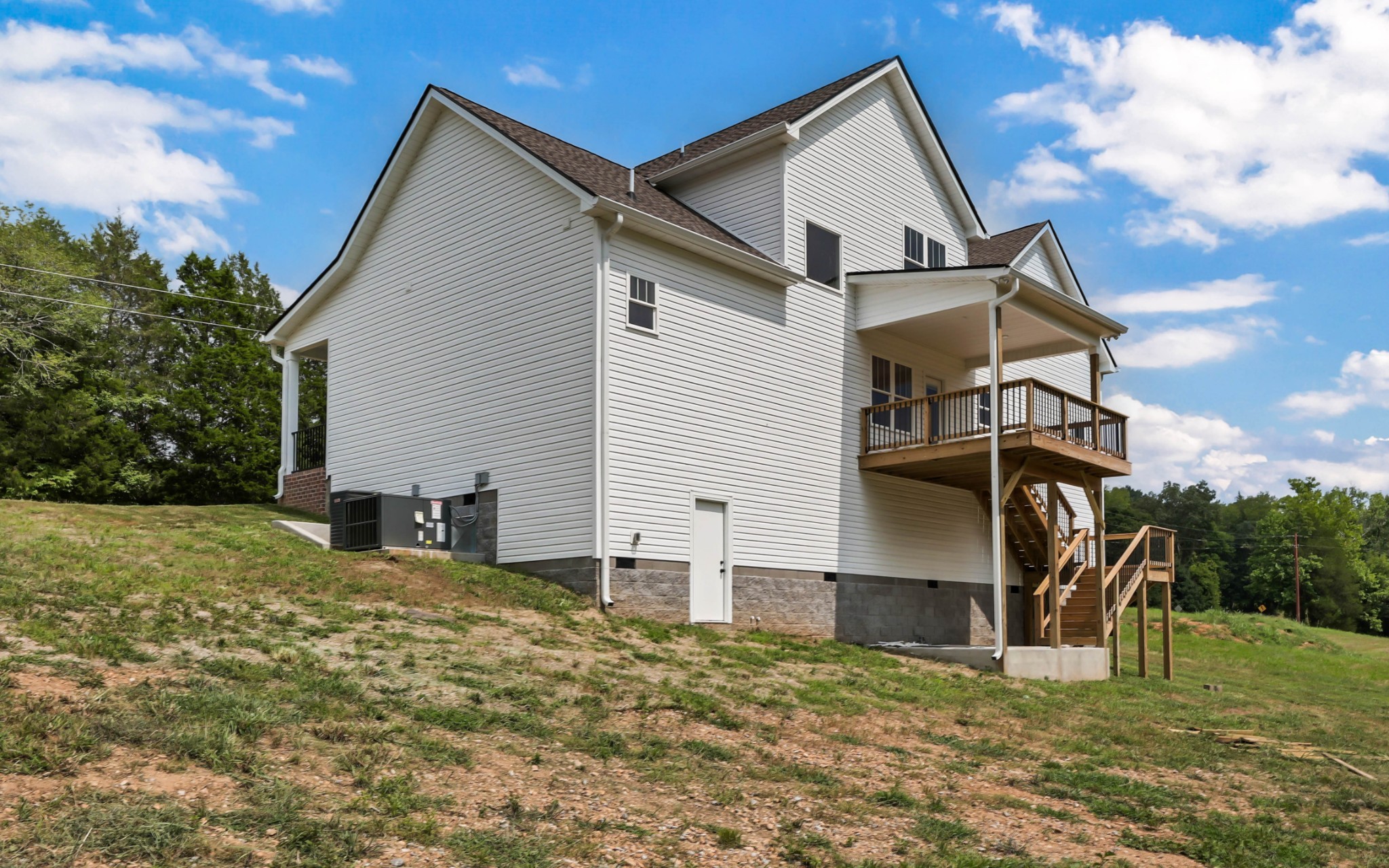 5590 Chambers Road Cumberland Furnace, TN 37051 - Photo 40 of 47 a view of a house with backyard and a tree