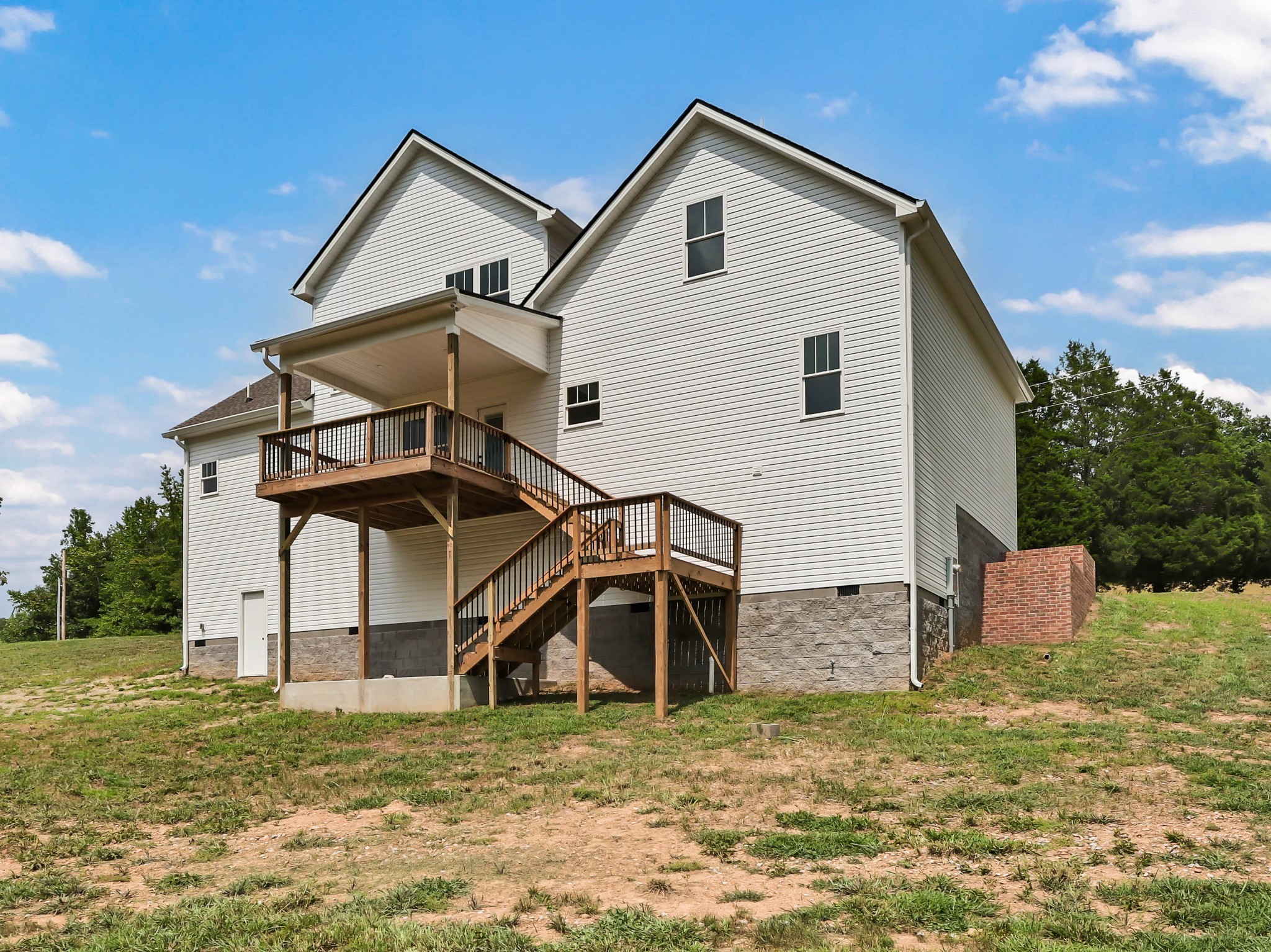 5590 Chambers Road Cumberland Furnace, TN 37051 - Photo 44 of 47 a view of a house with backyard and trees