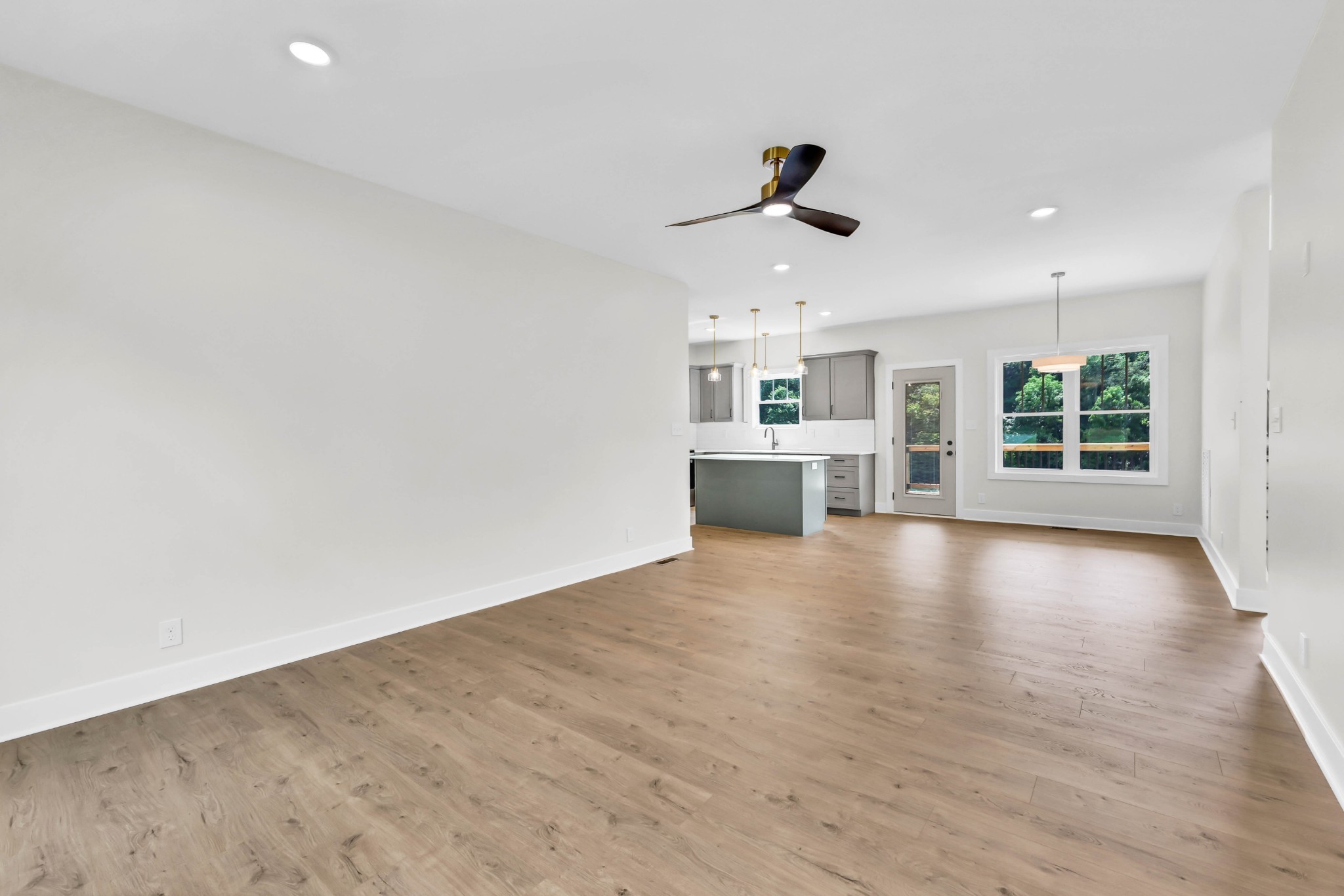 5590 Chambers Road Cumberland Furnace, TN 37051 - Photo 7 of 47 a view of an empty room with a window and wooden floor