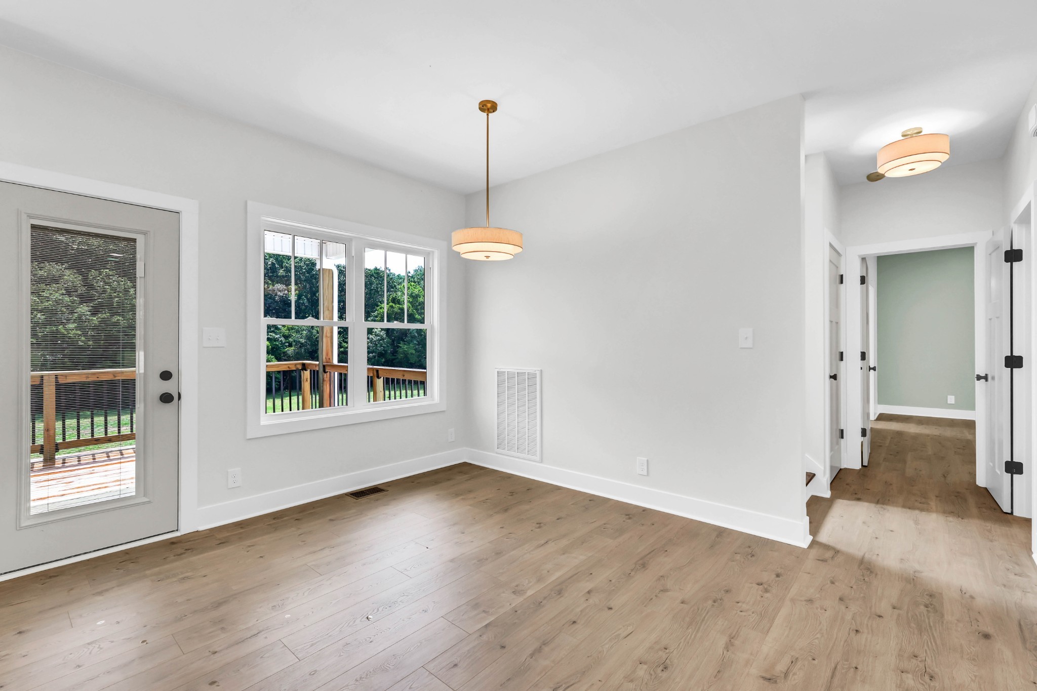 5590 Chambers Road Cumberland Furnace, TN 37051 - Photo 9 of 47 a view of empty room with wooden floor and fan