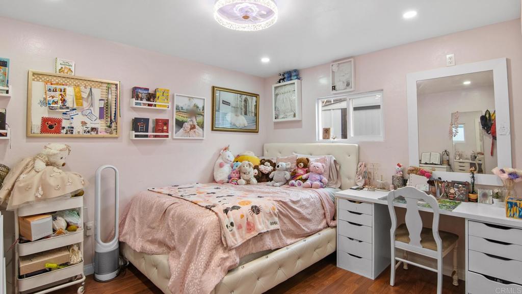 1455 Alturas Street, Unit 46 Fallbrook, CA 92028 - Photo 15 of 34 a bedroom with a bed and a bookshelf
