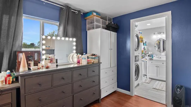 a bathroom with a granite countertop sink a shower and a mirror