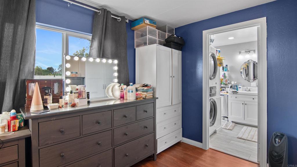 1455 Alturas Street, Unit 46 Fallbrook, CA 92028 - Photo 17 of 34 a bathroom with a double vanity sink and mirror