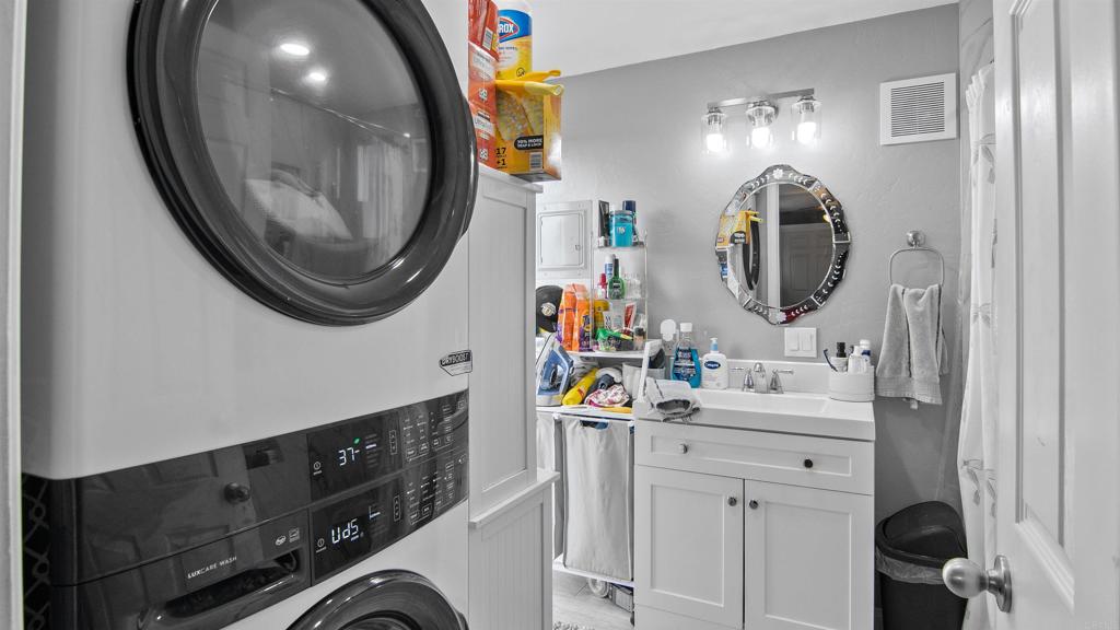 1455 Alturas Street, Unit 46 Fallbrook, CA 92028 - Photo 19 of 34 a bathroom with a sink vanity mirror and toilet
