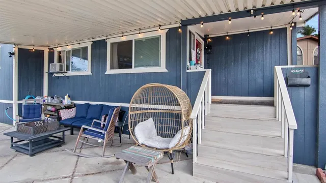 a living room with patio furniture