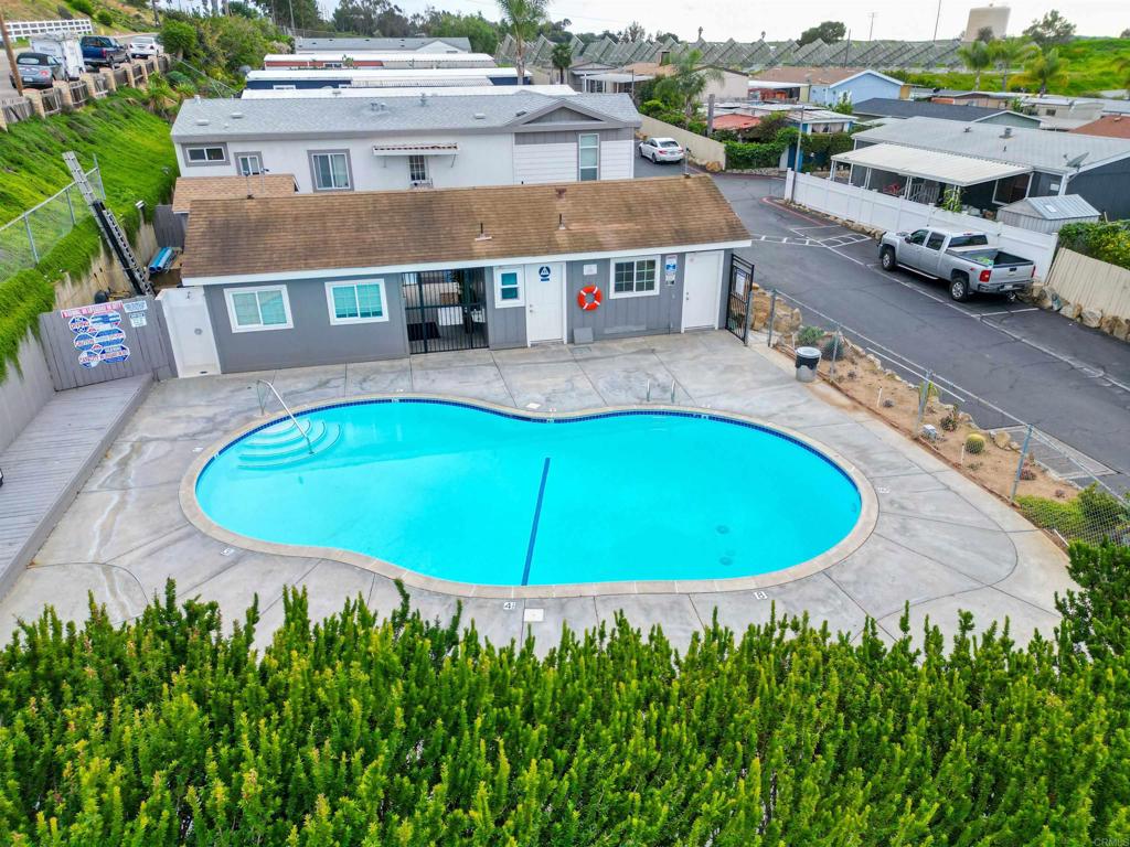1455 Alturas Street, Unit 46 Fallbrook, CA 92028 - Photo 29 of 34 an aerial view of a house with swimming pool and garden