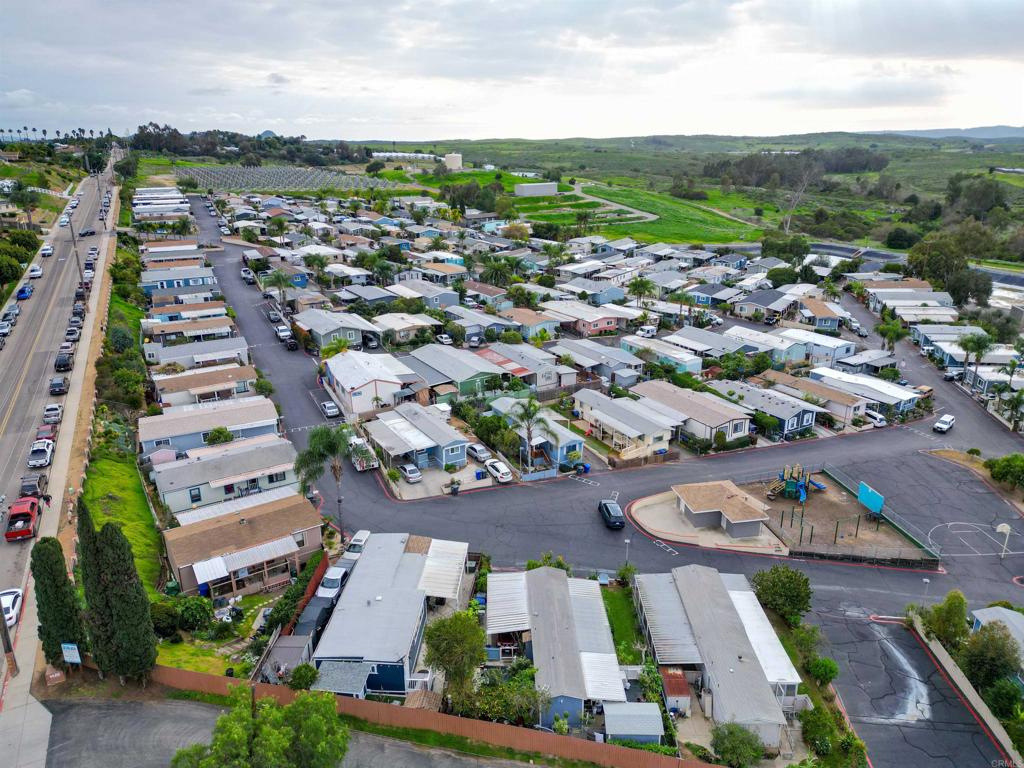 1455 Alturas Street, Unit 46 Fallbrook, CA 92028 - Photo 31 of 34 an aerial view of residential houses with outdoor space
