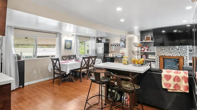 a view of a dining room with furniture window and outside view