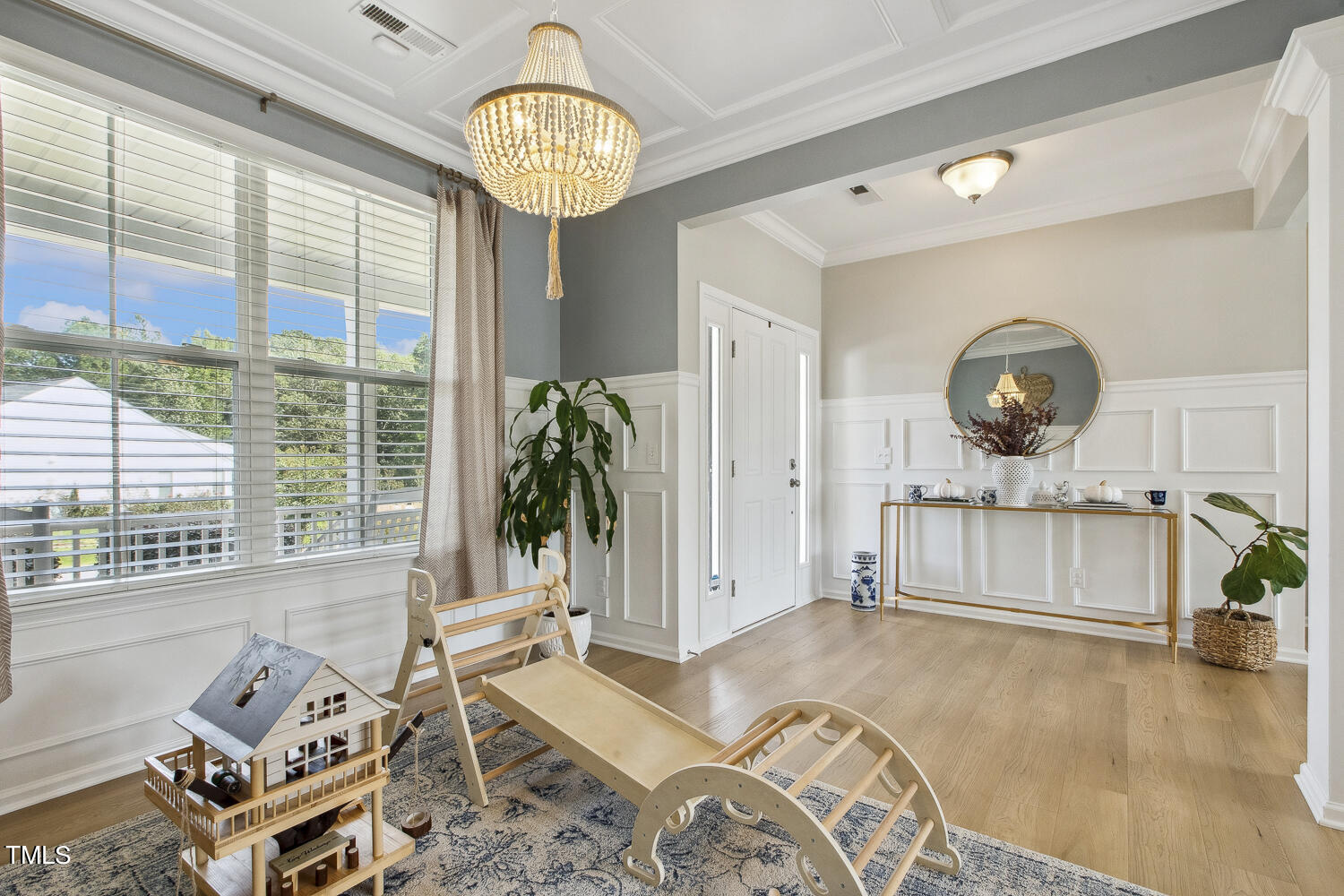 3604 Norman Blalock Road Willow Spring, NC 27592 - Photo 11 of 51 a living room with furniture and a chandelier