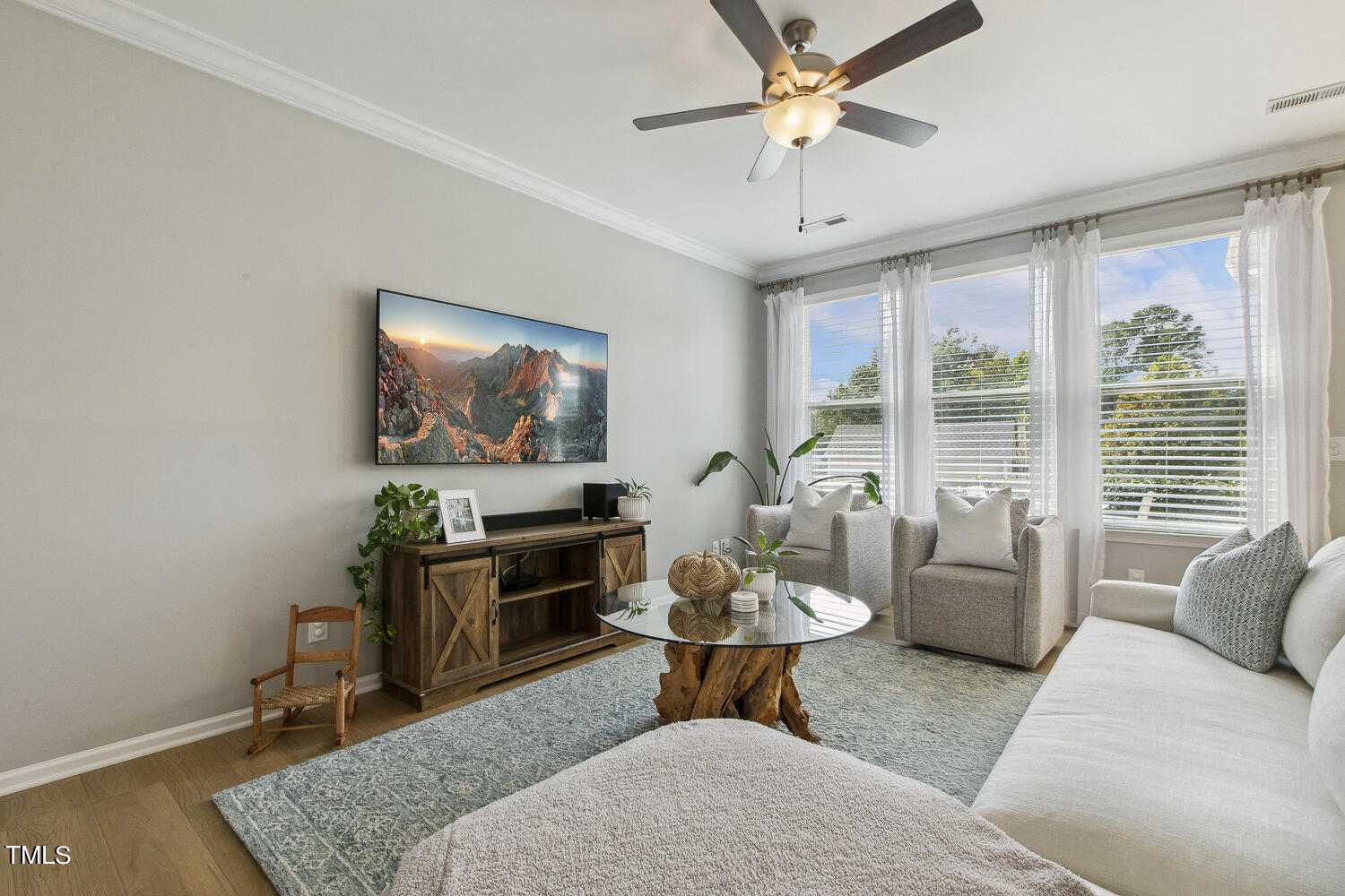 3604 Norman Blalock Road Willow Spring, NC 27592 - Photo 14 of 51 a living room with furniture and a window