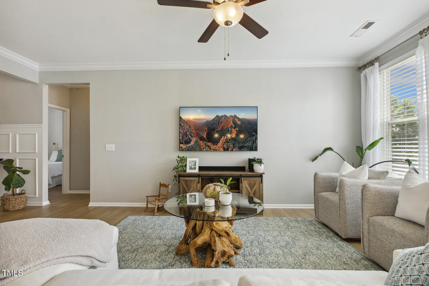 3604 Norman Blalock Road Willow Spring, NC 27592 - Photo 15 of 51 a living room with furniture and a flat screen tv