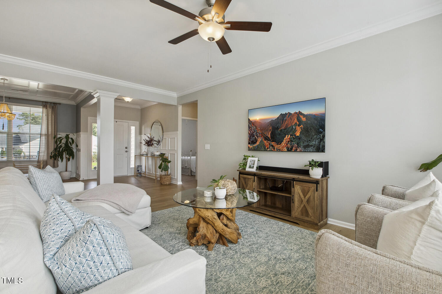 3604 Norman Blalock Road Willow Spring, NC 27592 - Photo 16 of 51 a living room with furniture and a flat screen tv