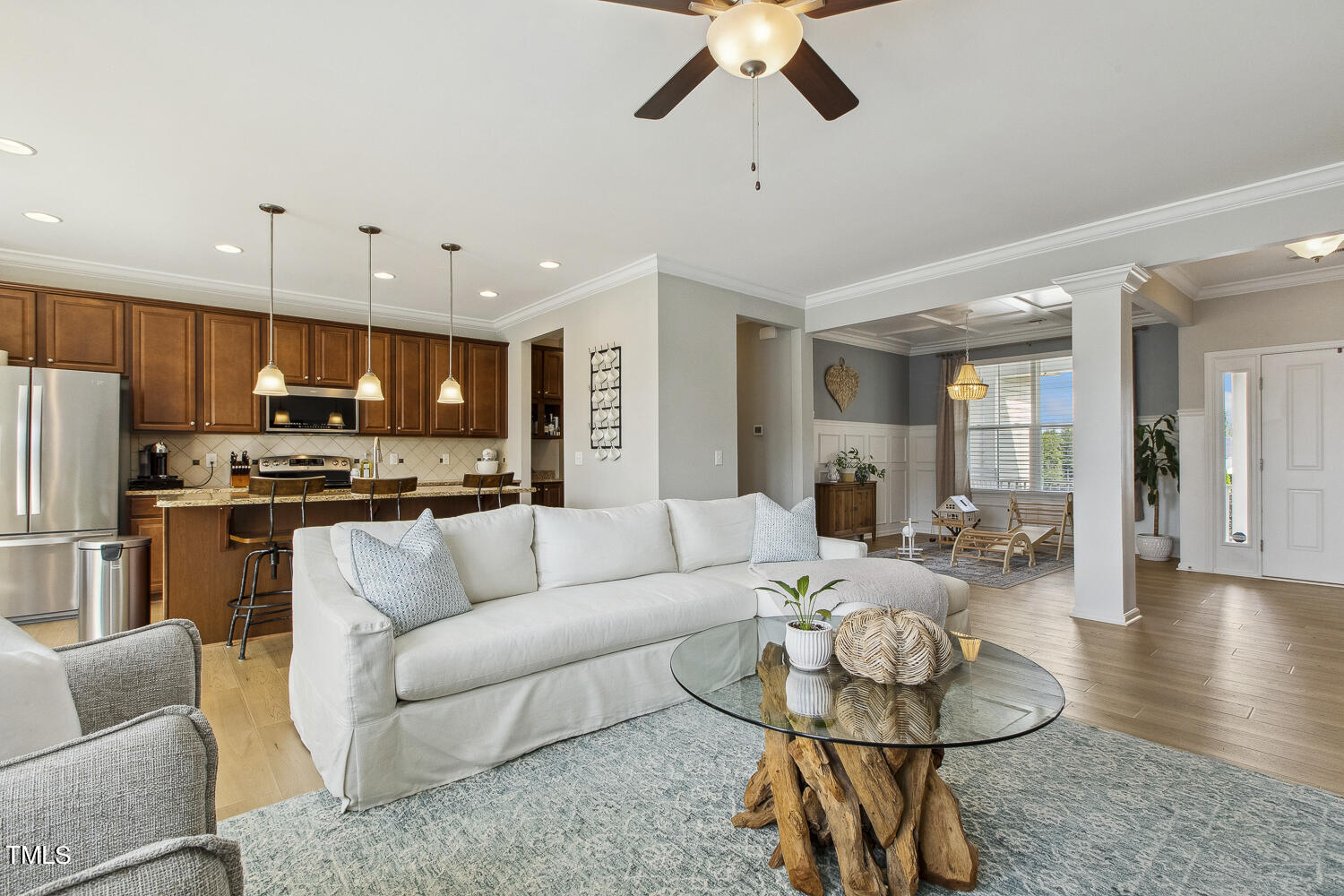 3604 Norman Blalock Road Willow Spring, NC 27592 - Photo 17 of 51 a living room with furniture kitchen and a chandelier