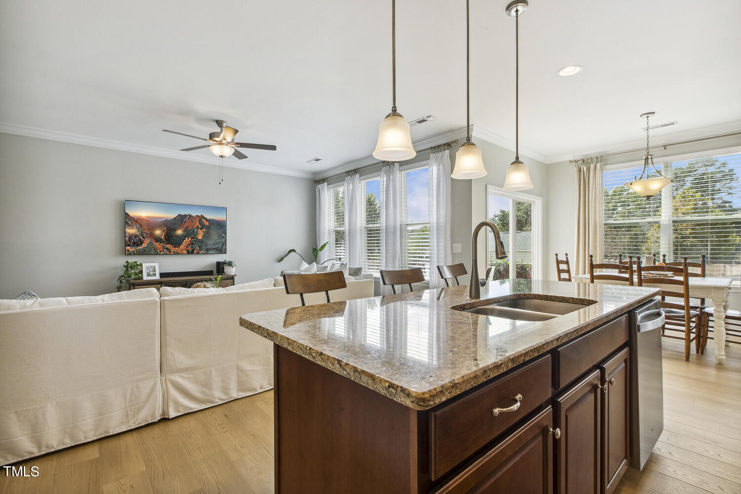 3604 Norman Blalock Road Willow Spring, NC 27592 - Photo 18 of 51 a kitchen with a center island and living room view