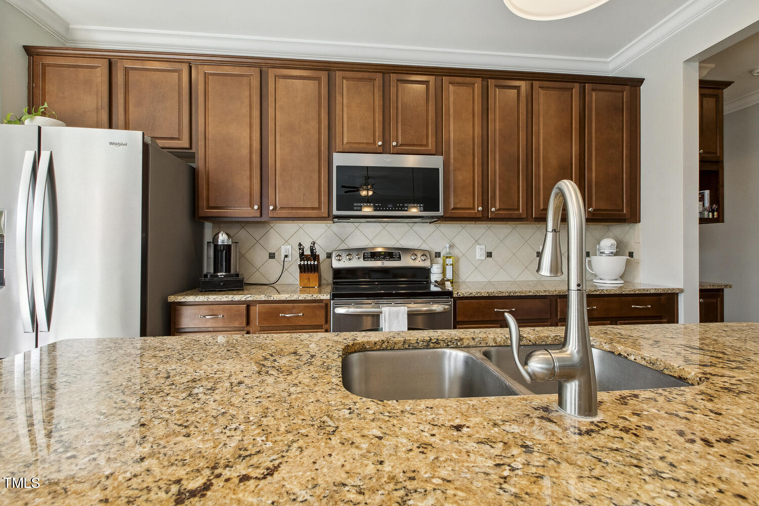 3604 Norman Blalock Road Willow Spring, NC 27592 - Photo 20 of 51 a kitchen with granite countertop a refrigerator sink and cabinets