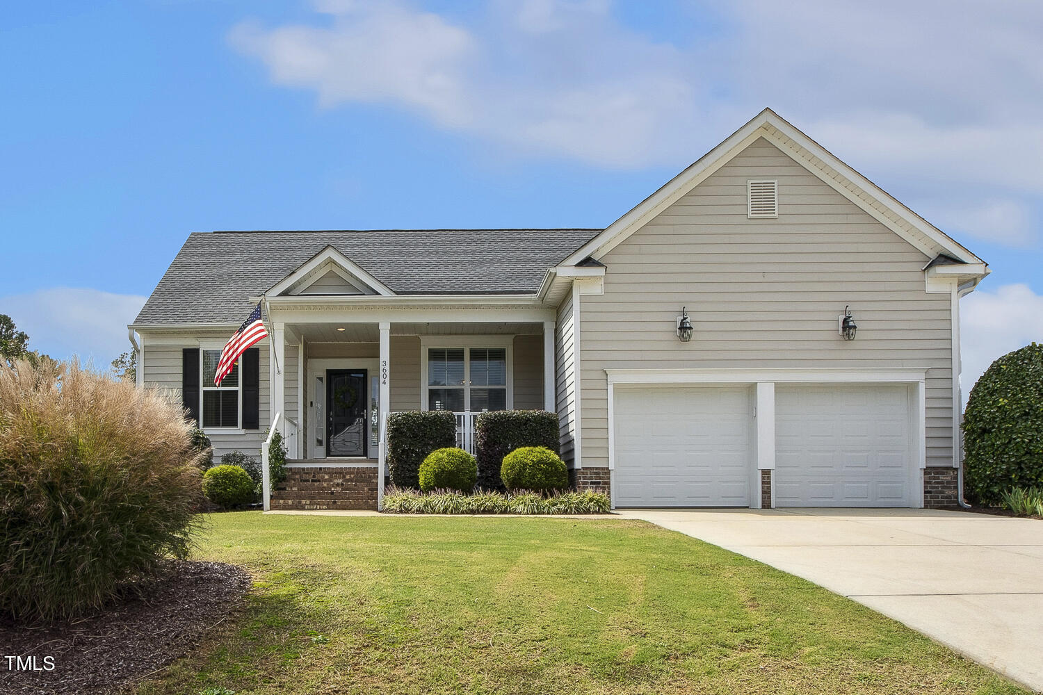 3604 Norman Blalock Road Willow Spring, NC 27592 - Photo 2 of 51 a front view of a house with garden