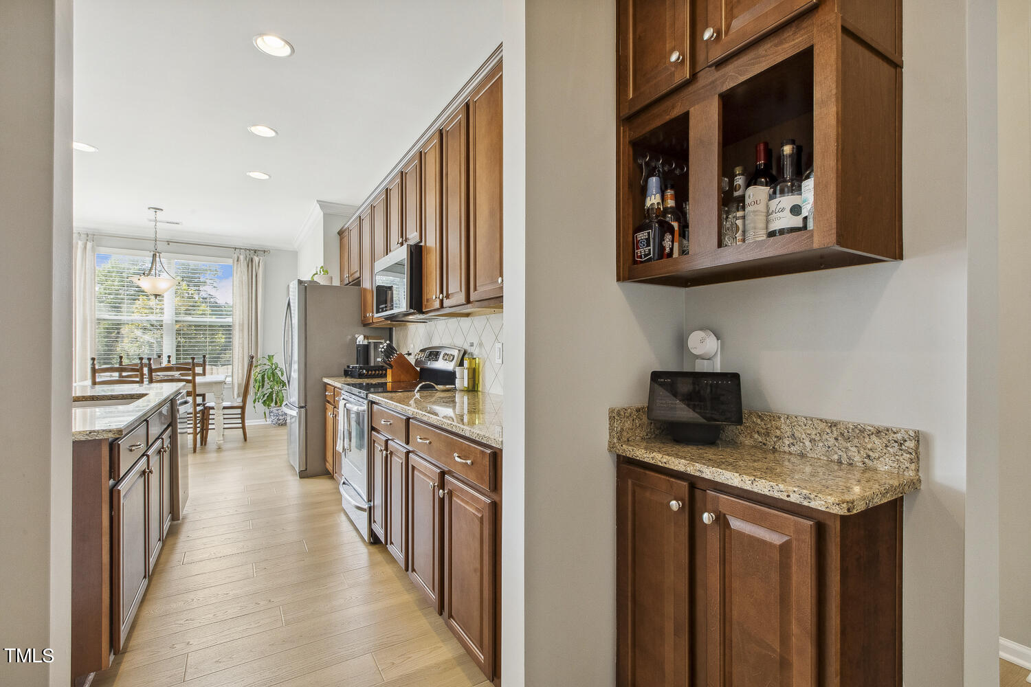 3604 Norman Blalock Road Willow Spring, NC 27592 - Photo 22 of 51 a kitchen with stainless steel appliances granite countertop a stove and a sink