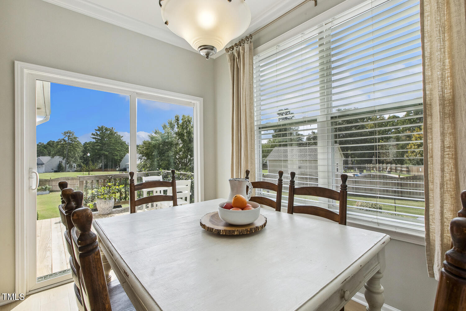 3604 Norman Blalock Road Willow Spring, NC 27592 - Photo 26 of 51 a view of a dining room with furniture window and outside view