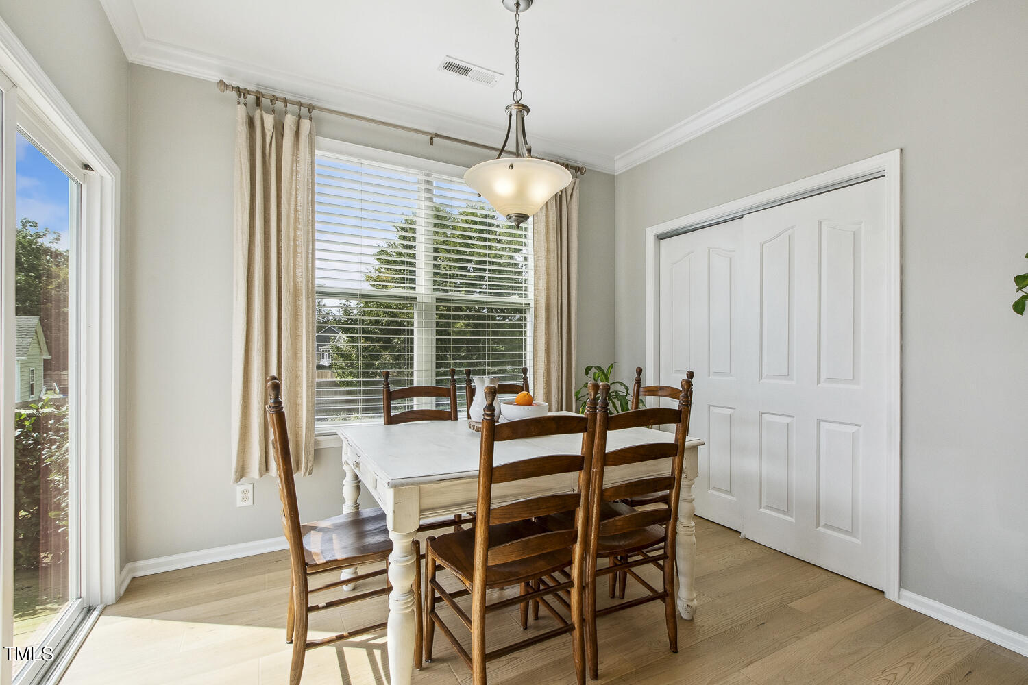 3604 Norman Blalock Road Willow Spring, NC 27592 - Photo 27 of 51 a dining room with furniture and window