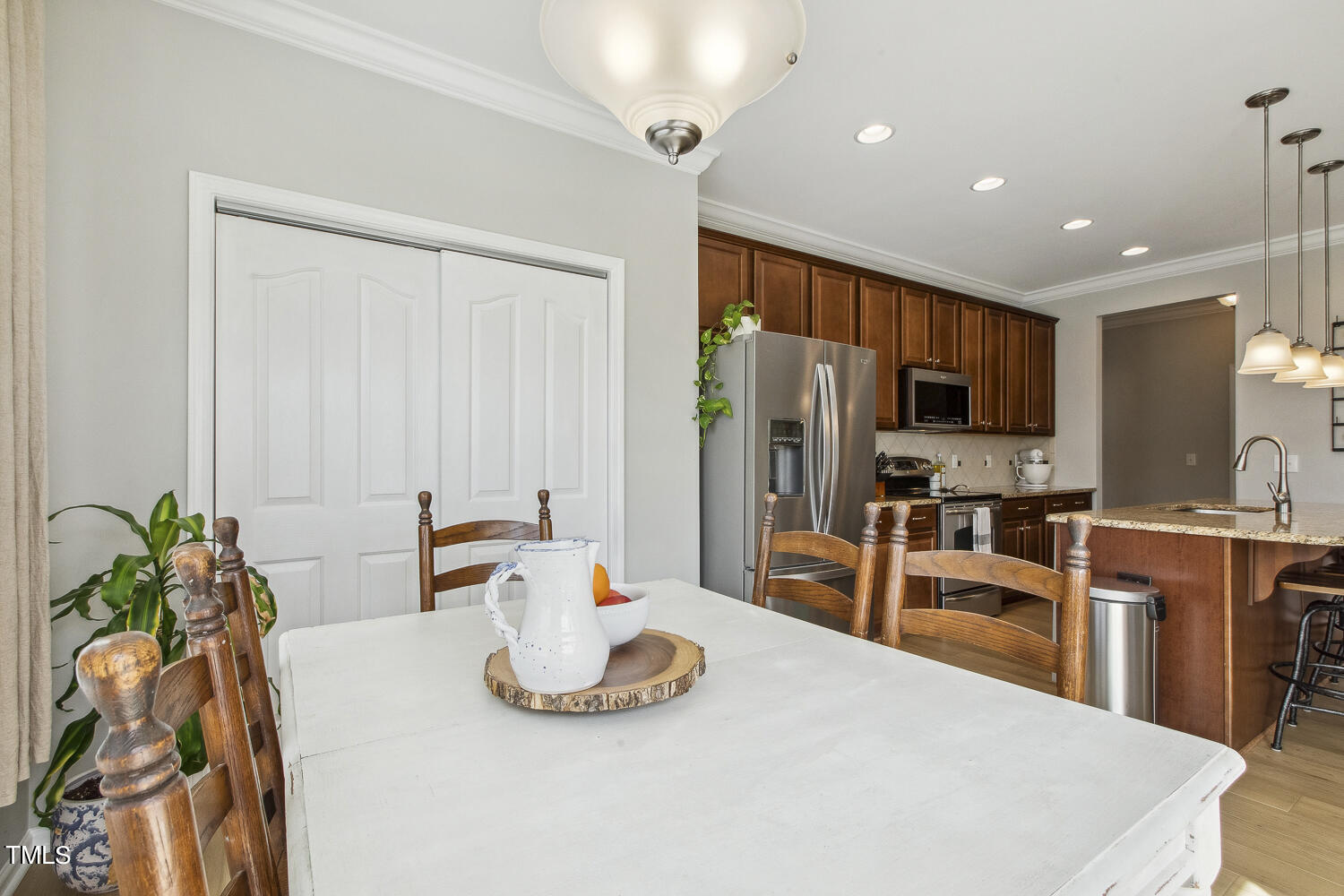 3604 Norman Blalock Road Willow Spring, NC 27592 - Photo 28 of 51 a kitchen with stainless steel appliances a sink and a refrigerator