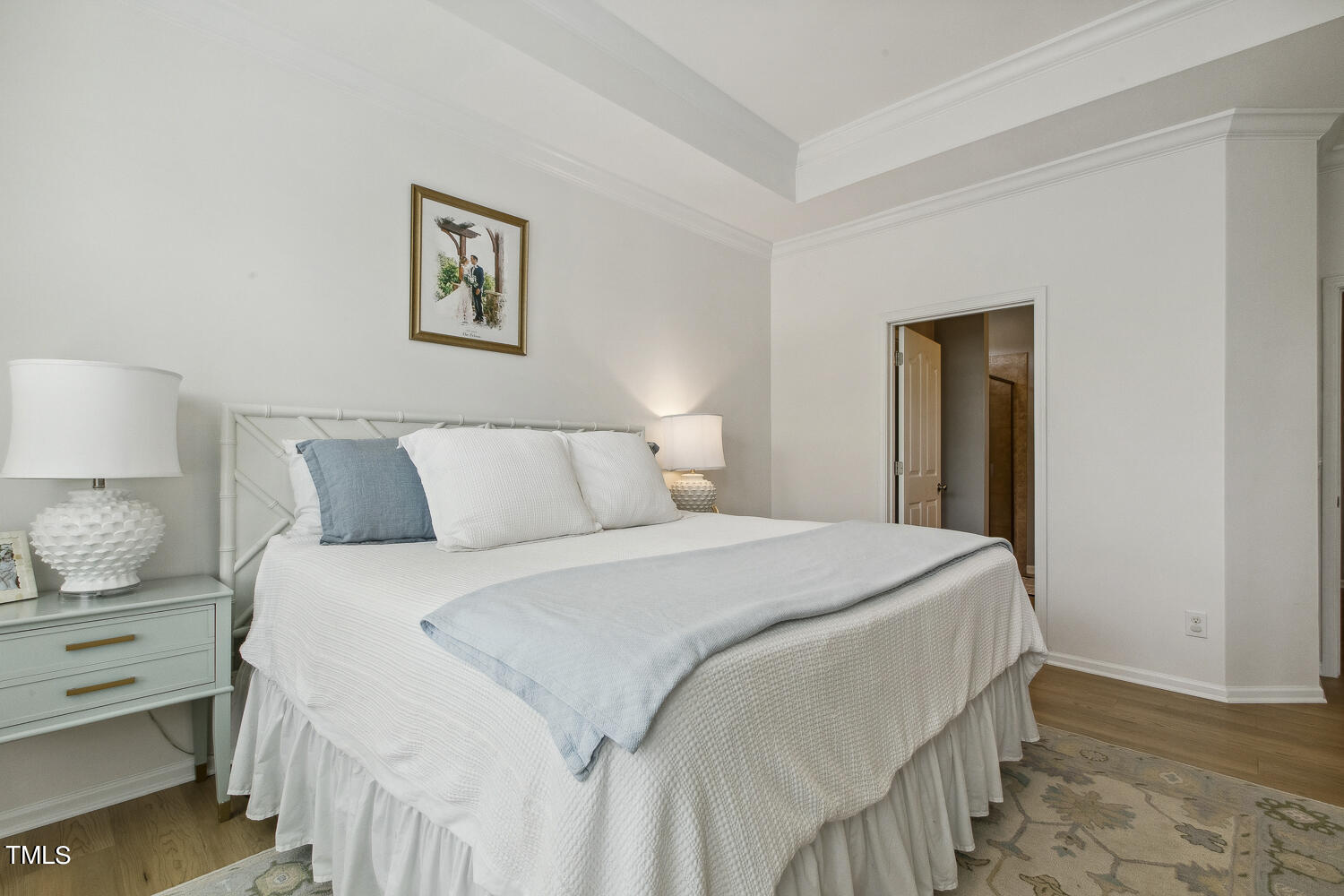 3604 Norman Blalock Road Willow Spring, NC 27592 - Photo 30 of 51 a bedroom with a bed and a lamp