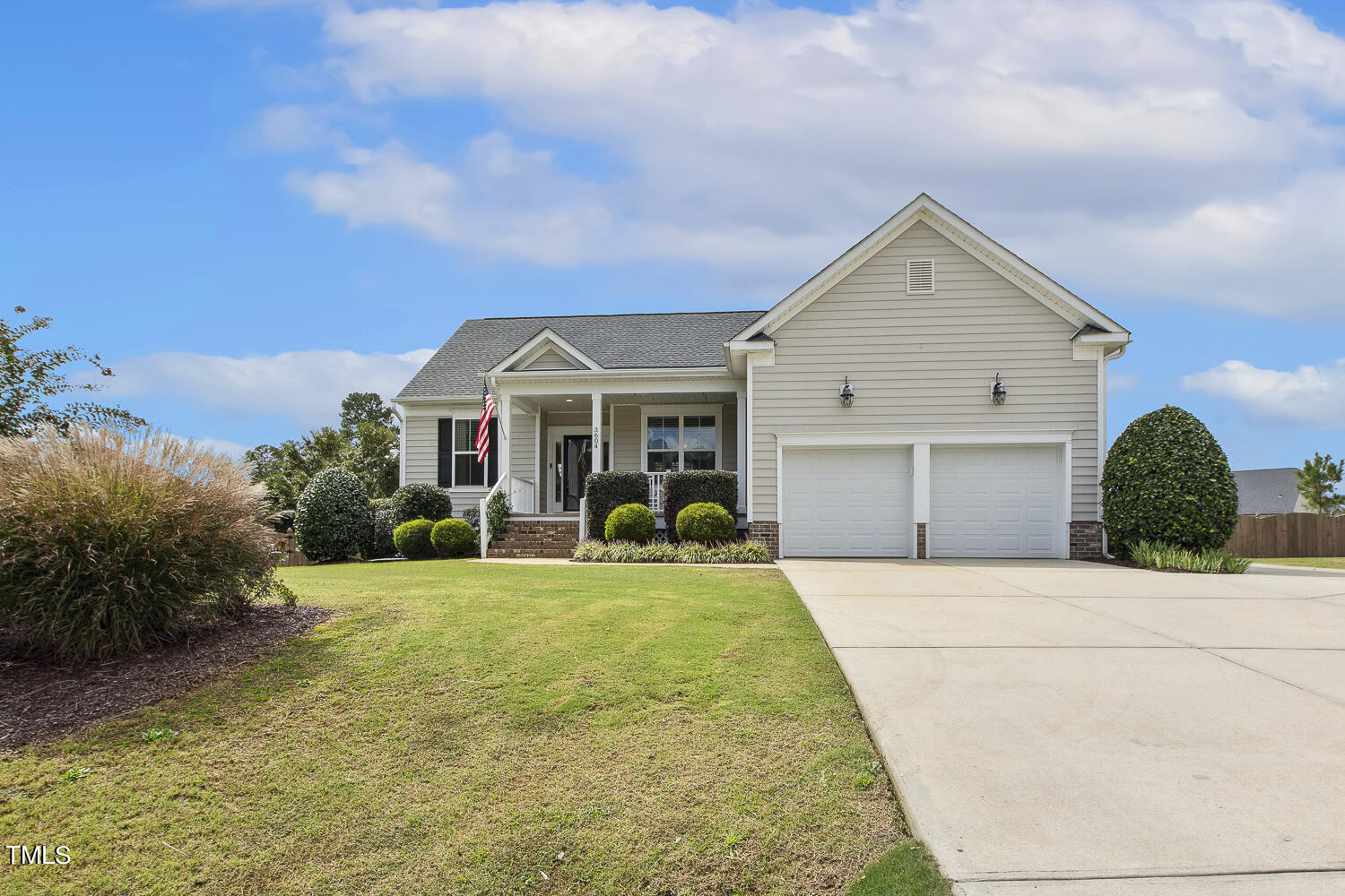 3604 Norman Blalock Road Willow Spring, NC 27592 - Photo 3 of 51 a front view of a house with yard and green space