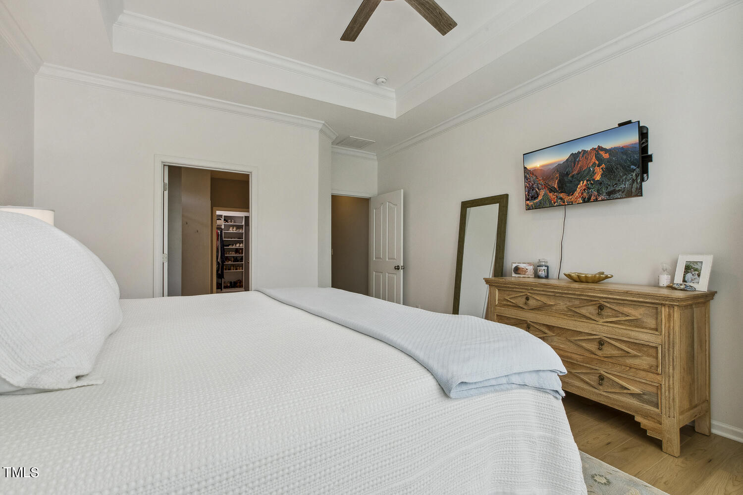 3604 Norman Blalock Road Willow Spring, NC 27592 - Photo 31 of 51 a bedroom with a bed and a flat screen tv