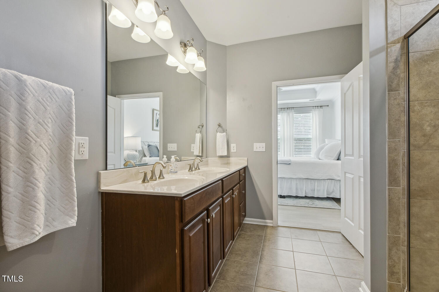 3604 Norman Blalock Road Willow Spring, NC 27592 - Photo 35 of 51 a bathroom with a sink a mirror and a shower