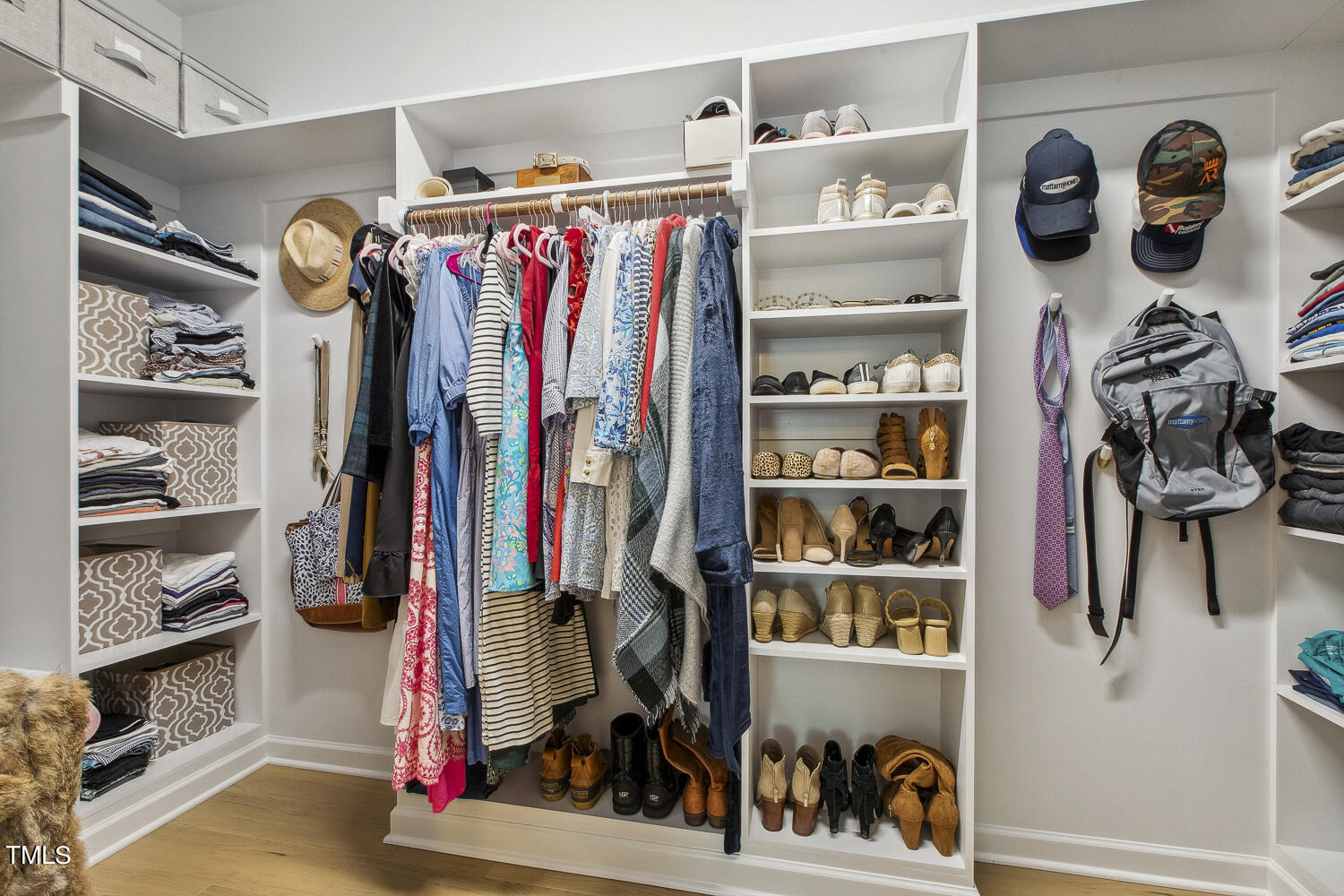 3604 Norman Blalock Road Willow Spring, NC 27592 - Photo 36 of 51 a view of walk in closet with clothes and shoes