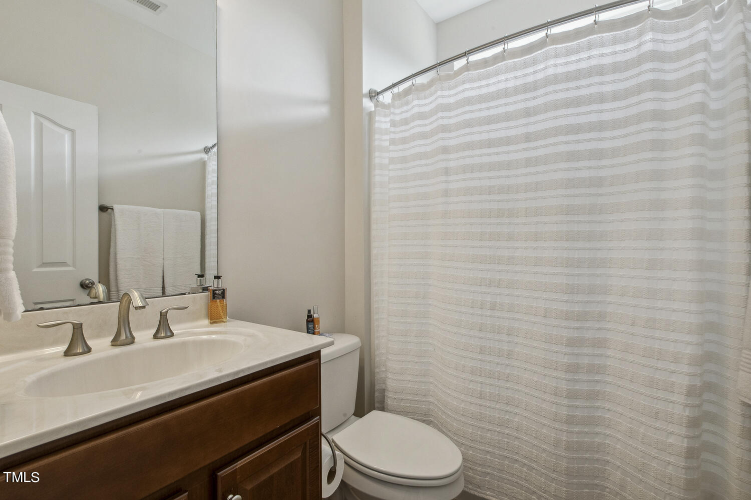 3604 Norman Blalock Road Willow Spring, NC 27592 - Photo 39 of 51 a bathroom with a granite countertop sink toilet and mirror