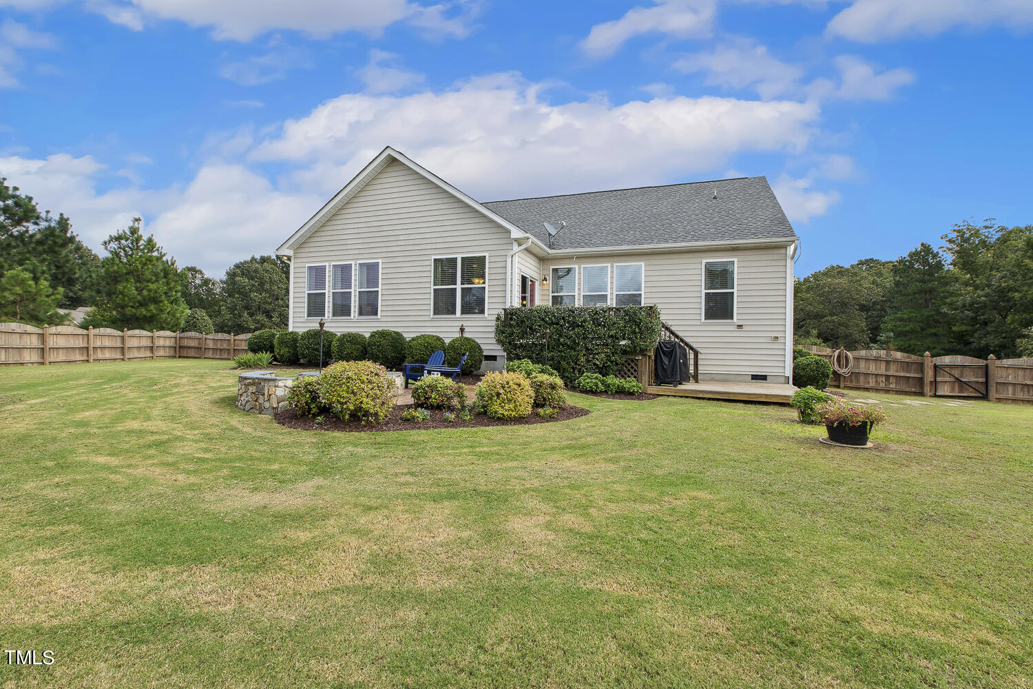 3604 Norman Blalock Road Willow Spring, NC 27592 - Photo 44 of 51 a view of a house with a yard and plants