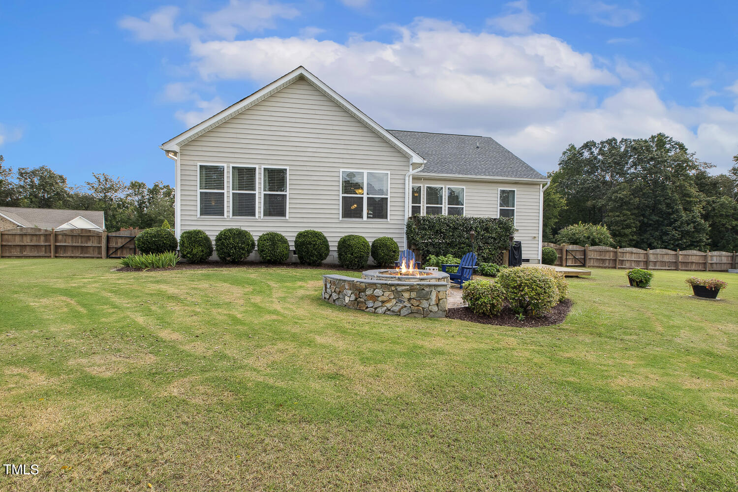 3604 Norman Blalock Road Willow Spring, NC 27592 - Photo 45 of 51 a view of house with backyard and outdoor seating