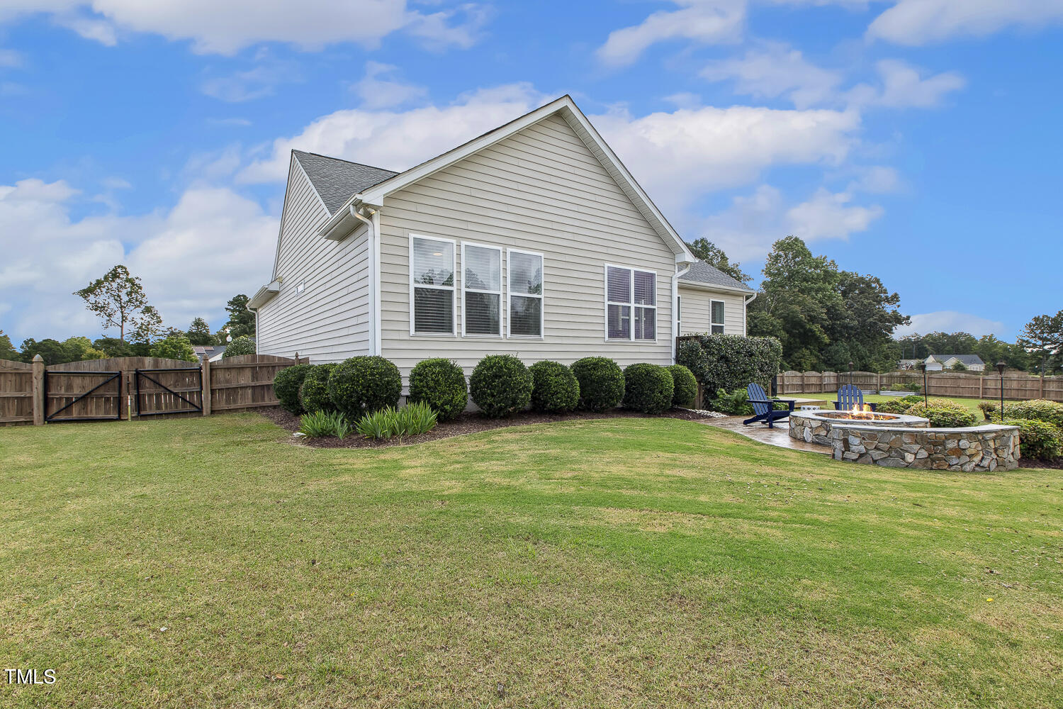 3604 Norman Blalock Road Willow Spring, NC 27592 - Photo 46 of 51 a view of a house with backyard porch and sitting area