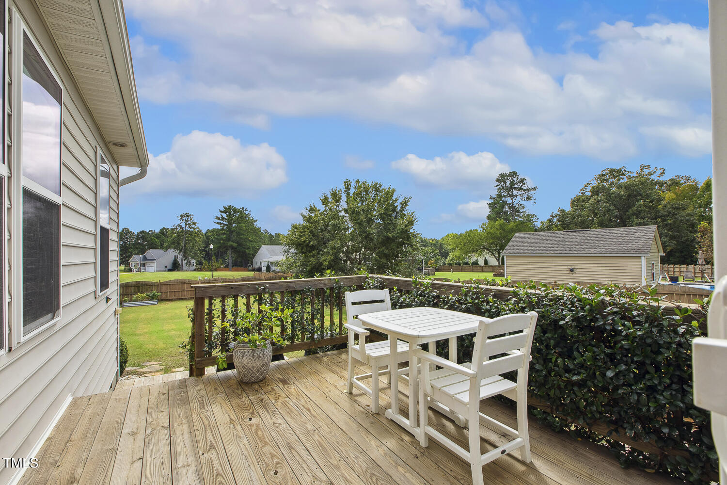 3604 Norman Blalock Road Willow Spring, NC 27592 - Photo 47 of 51 a balcony with wooden floor outdoor seating and barbeque oven