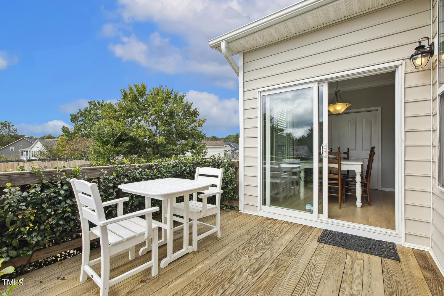 3604 Norman Blalock Road Willow Spring, NC 27592 - Photo 48 of 51 a balcony with table and chairs